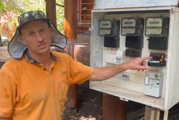 Jeremy Alderson from JA Electrical & Solar inspecting the meter box and service mains